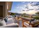 Lounge on a patio with a linear fire pit offering relaxing views of the sunset and mountain range at 667 Palisade Rim Dr, Henderson, NV 89012