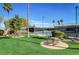 Relax and unwind at the community picnic area with lush green grass and palm trees at 667 Palisade Rim Dr, Henderson, NV 89012