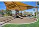 Community playground with slide, swings, benches, and shade, perfect for to enjoy at 667 Palisade Rim Dr, Henderson, NV 89012