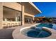 Modern pool with a connecting jacuzzi and bar, perfect for entertaining guests in style at 667 Palisade Rim Dr, Henderson, NV 89012