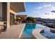 An expansive pool with an outdoor kitchen and views of the surrounding hills at 667 Palisade Rim Dr, Henderson, NV 89012