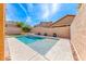 Inviting backyard pool featuring sleek concrete accents and decorative plants around the perimeter at 689 Silver Pearl St, Henderson, NV 89002