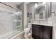Bathroom featuring a glass-enclosed shower, modern vanity, and neutral tones at 689 Silver Pearl St, Henderson, NV 89002
