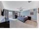 Bedroom features a cozy bed, modern furniture, and a sliding glass door to the outside at 689 Silver Pearl St, Henderson, NV 89002
