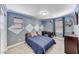 Comfortable bedroom featuring gray walls, carpet flooring, a window, and a sleek black desk at 689 Silver Pearl St, Henderson, NV 89002