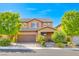 Charming two-story home featuring desert landscaping and a tile roof at 689 Silver Pearl St, Henderson, NV 89002
