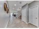 Spacious foyer with staircase and open floor plan, featuring wood-look tile at 689 Silver Pearl St, Henderson, NV 89002