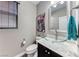 Elegant powder room featuring gray walls, a unique glass bowl sink, and modern fixtures at 689 Silver Pearl St, Henderson, NV 89002