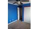 Cozy bedroom with a ceiling fan and closet; perfect for relaxation and storage at 7073 Seabirds Pl, North Las Vegas, NV 89084