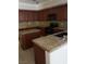 Spacious kitchen with wood cabinets, granite countertops, and modern appliances for a contemporary cooking experience at 7073 Seabirds Pl, North Las Vegas, NV 89084
