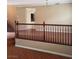 Bright living room area with banister and hardwood floors at 7073 Seabirds Pl, North Las Vegas, NV 89084
