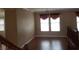 Living room with hardwood floors, neutral paint, and abundant natural light at 7073 Seabirds Pl, North Las Vegas, NV 89084