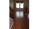 Living room with hardwood floors, staircase, and modern lighting at 7073 Seabirds Pl, North Las Vegas, NV 89084