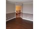 Inviting living room with hardwood floors and staircase access; an ideal space for entertaining at 7073 Seabirds Pl, North Las Vegas, NV 89084