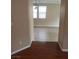 Open living area leads to a space with tile flooring and natural light at 7073 Seabirds Pl, North Las Vegas, NV 89084