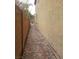 Paver walkway leading alongside home to backyard; great side yard access at 7073 Seabirds Pl, North Las Vegas, NV 89084