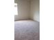 Bright and spacious bedroom showcasing neutral-colored walls and carpet at 7342 Tanglewood Park St, Las Vegas, NV 89166