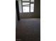 Bright carpeted bedroom featuring large windows providing ample natural light at 7342 Tanglewood Park St, Las Vegas, NV 89166