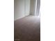 Neutral-colored bedroom featuring plush carpet and a sliding glass door at 7342 Tanglewood Park St, Las Vegas, NV 89166