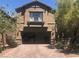 Inviting two-story home with a brick-paved driveway and an attached two-car garage at 7342 Tanglewood Park St, Las Vegas, NV 89166