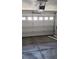 Attached garage featuring an automatic door opener and plenty of space for parking and storage at 7342 Tanglewood Park St, Las Vegas, NV 89166