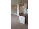 An open concept with the kitchen island featuring granite counters and stylish pendant lighting at 7342 Tanglewood Park St, Las Vegas, NV 89166