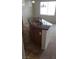 Kitchen island featuring a granite countertop and a double sink at 7342 Tanglewood Park St, Las Vegas, NV 89166