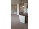 An open concept with the kitchen island featuring granite counters and stylish pendant lighting at 7342 Tanglewood Park St, Las Vegas, NV 89166