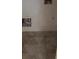 Utility room featuring tile floors and hookups for a washer and dryer at 7342 Tanglewood Park St, Las Vegas, NV 89166
