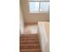 Carpeted staircase featuring a window near the top at 7342 Tanglewood Park St, Las Vegas, NV 89166