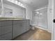 Modern bathroom with a walk-in glass shower, granite counters, and tile floors at 7452 Sunray Point St, North Las Vegas, NV 89084
