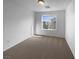 Inviting bedroom with natural light and neutral carpeting creates a comfortable space at 7452 Sunray Point St, North Las Vegas, NV 89084