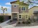 Tan two-story home with desert landscaping at 7452 Sunray Point St, North Las Vegas, NV 89084