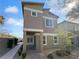 Charming two-story home with a modern design, complemented by a well-maintained front yard at 7452 Sunray Point St, North Las Vegas, NV 89084