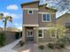 Inviting two-story house with a neat walkway and landscaping that enhances its curb appeal at 7452 Sunray Point St, North Las Vegas, NV 89084