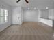 Unstaged living room featuring tiled flooring and bright, neutral walls and open floorplan at 7452 Sunray Point St, North Las Vegas, NV 89084