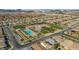 Community aerial view showcasing clubhouse, pool, and desert landscaping with surrounding residential properties at 746 Purple Knoll Walk, Henderson, NV 89011