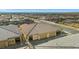 Overhead view of single Gathering homes with tile roofs and attached garages in a desert community at 746 Purple Knoll Walk, Henderson, NV 89011