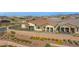 Expansive aerial view of single Gathering homes featuring desert landscaping and tiled roofs in a residential area at 746 Purple Knoll Walk, Henderson, NV 89011
