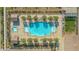 Aerial view of community pool with lounge area, cabanas, and lush landscaping, with desert environment at 746 Purple Knoll Walk, Henderson, NV 89011