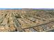 Areal view of the neighborhood with streets and mountain views beyond the community at 746 Purple Knoll Walk, Henderson, NV 89011