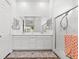 Bathroom with double sinks, tiled floors and a stand-up shower at 746 Purple Knoll Walk, Henderson, NV 89011
