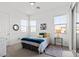 Cozy bedroom with a calm atmosphere featuring a ceiling fan and large windows at 746 Purple Knoll Walk, Henderson, NV 89011