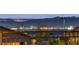 Stunning night cityscape view with illuminated buildings visible from the community at 746 Purple Knoll Walk, Henderson, NV 89011