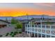 Scenic community view featuring desert landscaping, a walking bridge, and stunning sunset over the mountains at 746 Purple Knoll Walk, Henderson, NV 89011