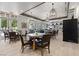 Community dining area with well-lit tables, pendant lights, and access to food and beverage areas at 746 Purple Knoll Walk, Henderson, NV 89011