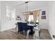 Stylish dining room with modern lighting, seating for four, and natural light at 746 Purple Knoll Walk, Henderson, NV 89011