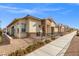 Inviting single-Gathering home with stone accents, a tiled roof, and professional landscaping at 746 Purple Knoll Walk, Henderson, NV 89011