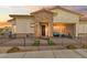 Charming single-story home with stone accents, a cozy front porch, and decorative iron fencing at 746 Purple Knoll Walk, Henderson, NV 89011