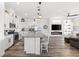Open kitchen showcases a large island, stainless appliances, and modern pendant lighting at 746 Purple Knoll Walk, Henderson, NV 89011